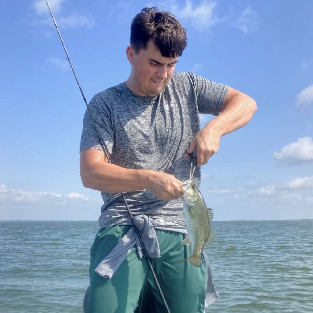 Unhooking A Largemouth Bass