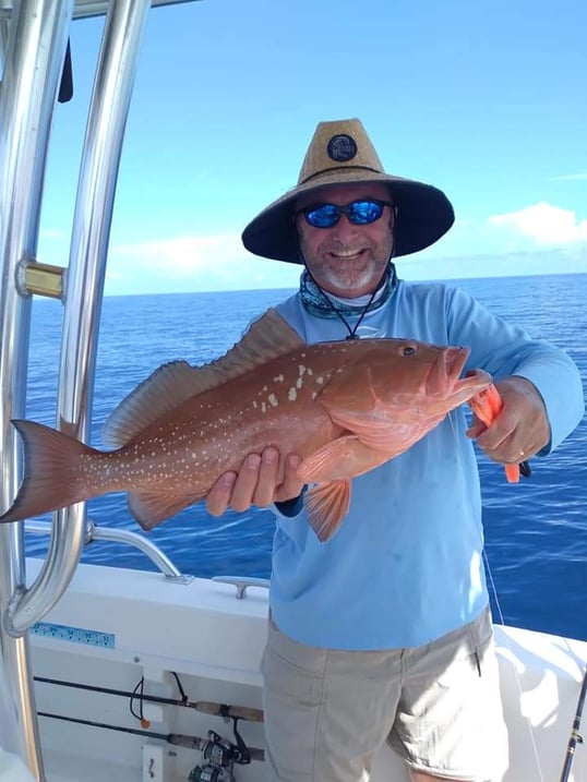 Man holding red grouper