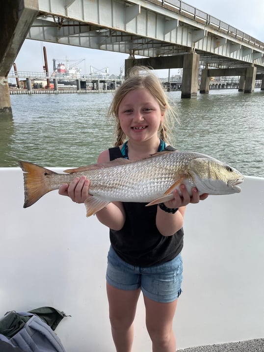 Little girl with redfish