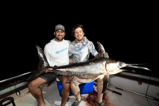 Men with tanzanian swordfish