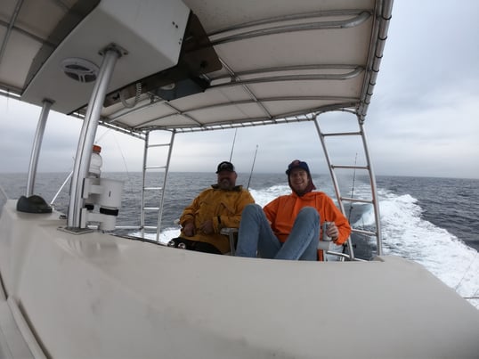 customer and guide on a fishing trip