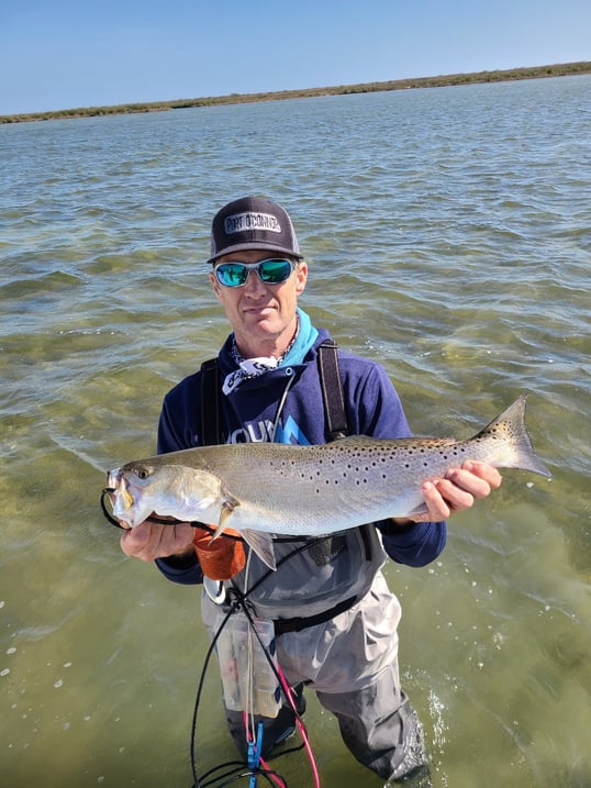 captain kenneth with a trout