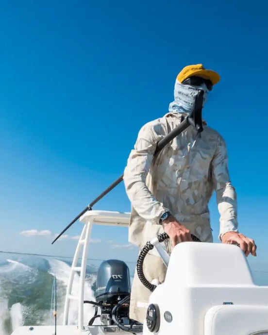 man driving a skiff