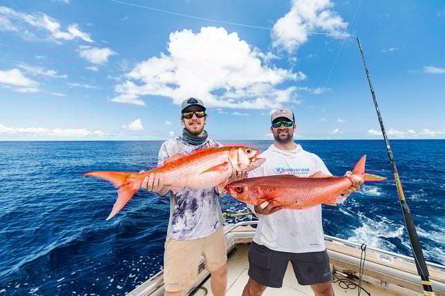 captain experiences founders attison and jonathan holding queen snapper